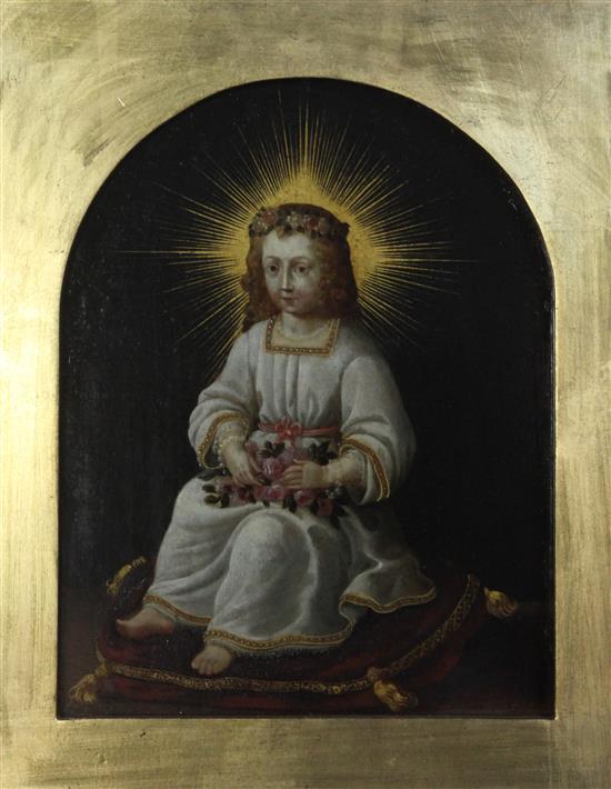 17th century Flemish School The Christ child holding roses and seated on a red cushion 13 x 10.25in.